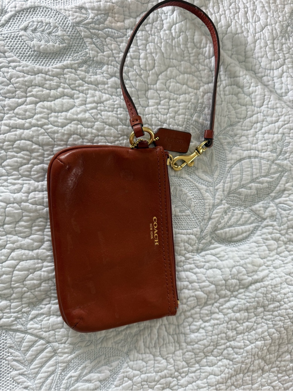 COACH Leather Wristlet in Cognac
